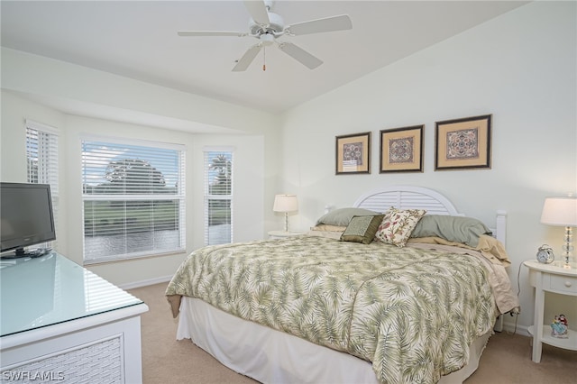 carpeted bedroom featuring vaulted ceiling and ceiling fan