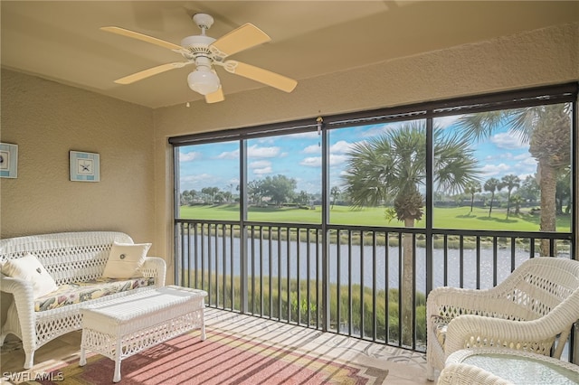 sunroom featuring ceiling fan