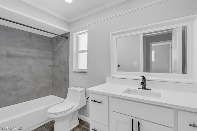 full bathroom featuring tiled shower / bath combo, vanity with extensive cabinet space, toilet, hardwood / wood-style flooring, and ornamental molding