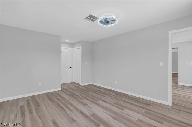 spare room with light wood-type flooring