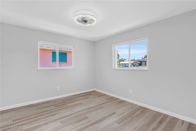 spare room with light hardwood / wood-style flooring