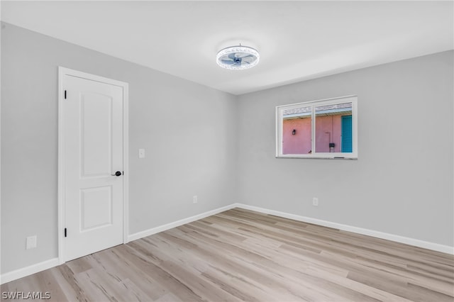 unfurnished room featuring light hardwood / wood-style floors