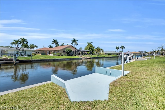 dock area featuring a water view and a yard