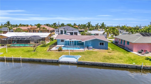 rear view of property with a lawn, a water view, a patio, and glass enclosure