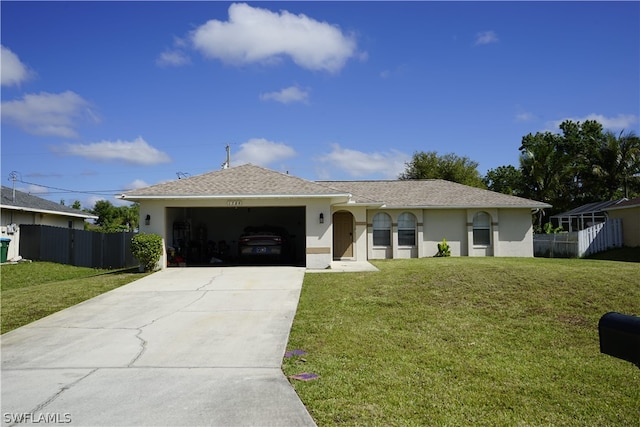 ranch-style house featuring a garage and a front lawn