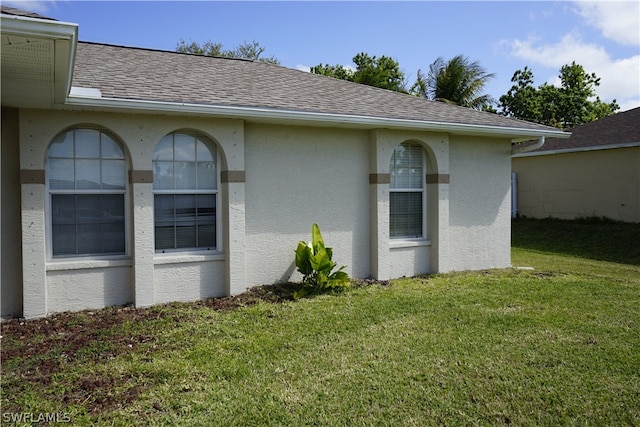 rear view of property with a yard