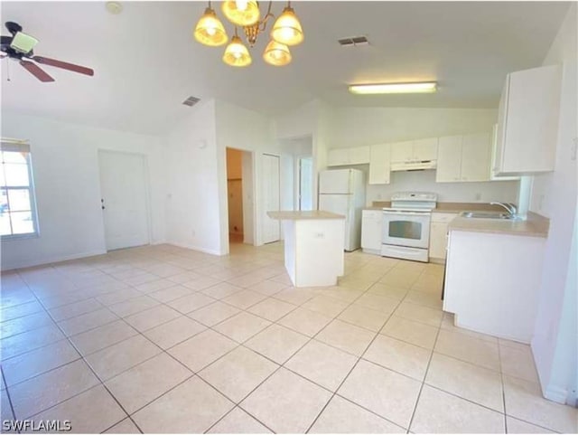 kitchen featuring white cabinets, pendant lighting, lofted ceiling, ceiling fan with notable chandelier, and white appliances