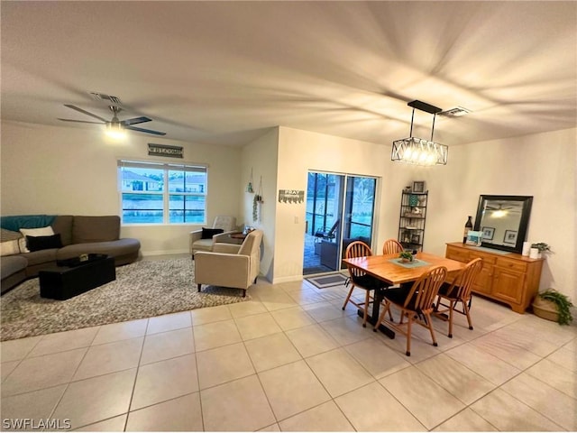 dining area featuring light tile patterned floors and ceiling fan