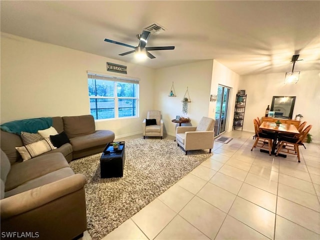 tiled living room featuring ceiling fan