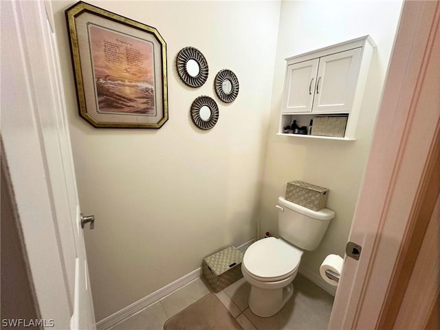 bathroom featuring toilet and tile patterned floors