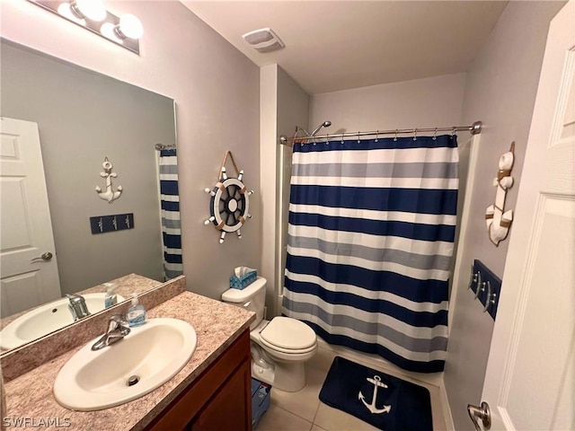 bathroom with tile patterned flooring, vanity, toilet, and curtained shower