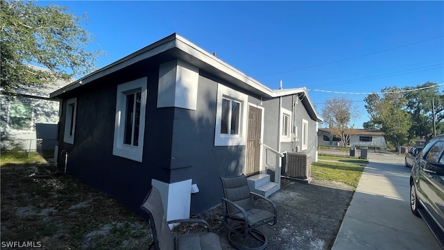 view of side of home featuring central air condition unit