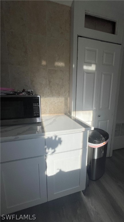 bathroom with hardwood / wood-style floors