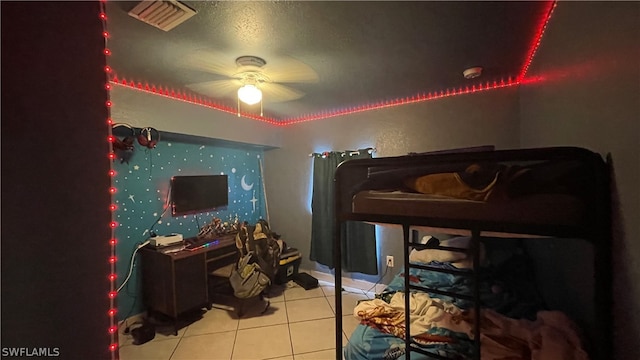 tiled bedroom with ceiling fan