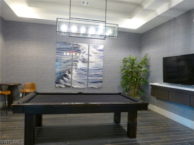 game room with a tray ceiling and pool table