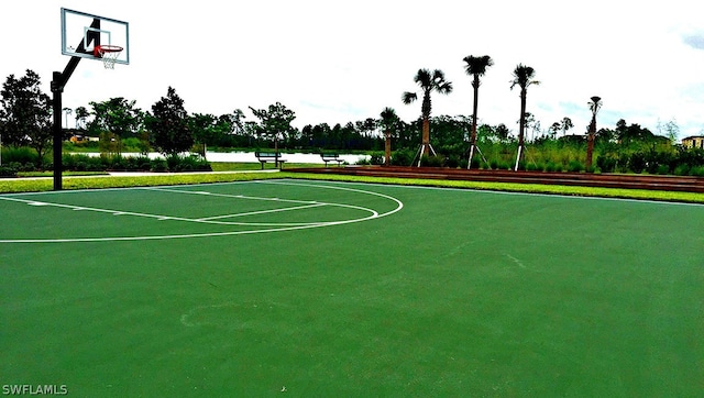 view of basketball court with a water view