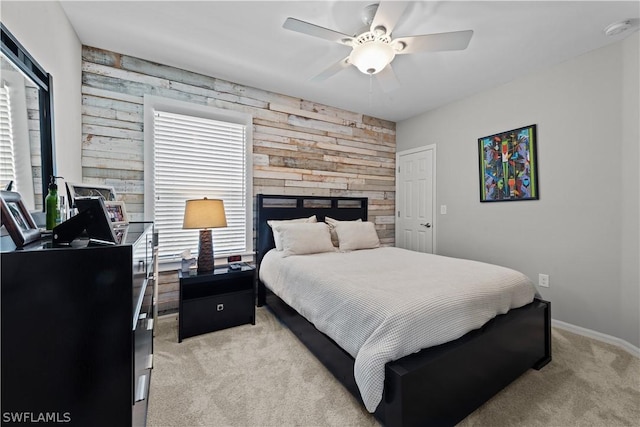 bedroom with ceiling fan and light colored carpet