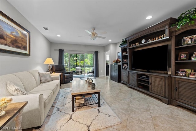 living room featuring ceiling fan and light tile patterned flooring