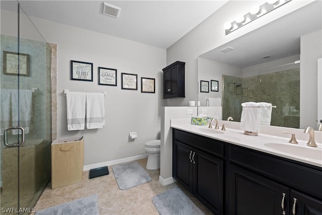 bathroom with toilet, vanity, tile patterned floors, and an enclosed shower