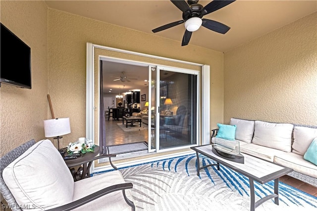 view of patio / terrace with ceiling fan and an outdoor hangout area