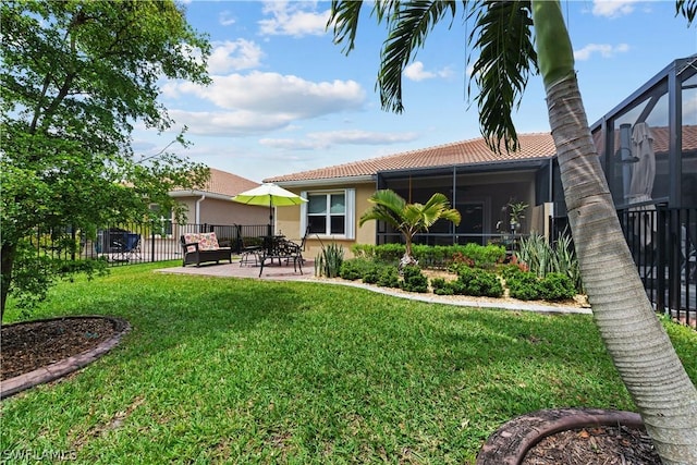 rear view of house with a patio area and a yard