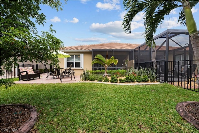 view of yard with a lanai and a patio