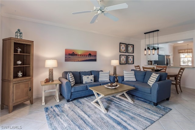 tiled living room featuring crown molding and ceiling fan