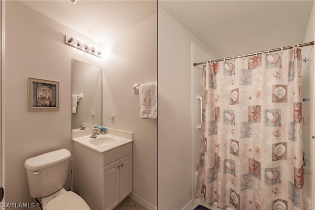 bathroom with large vanity and toilet