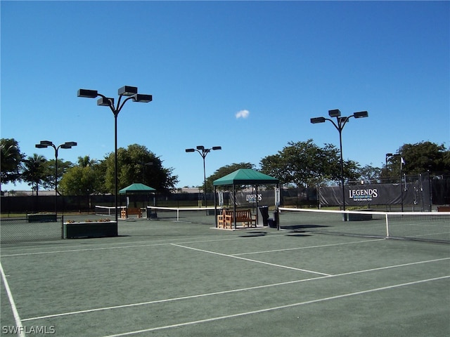 view of tennis court featuring a gazebo