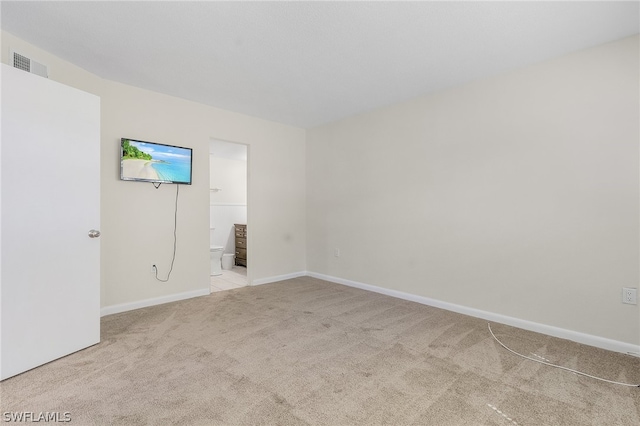 spare room with light colored carpet