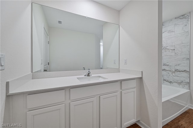 bathroom featuring hardwood / wood-style floors and vanity