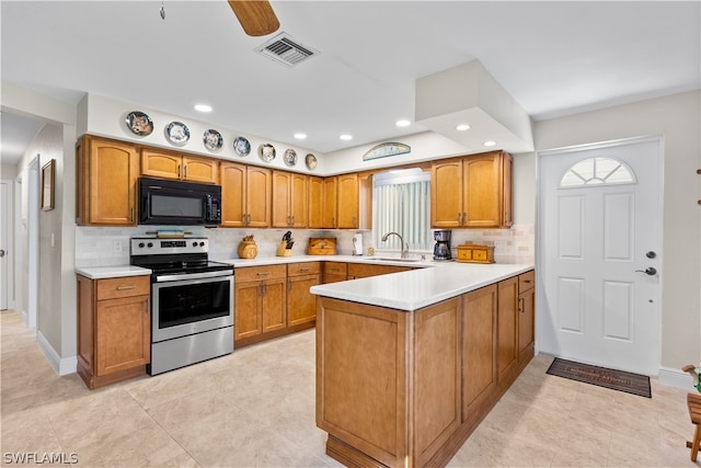 kitchen with backsplash, kitchen peninsula, electric stove, and light tile floors