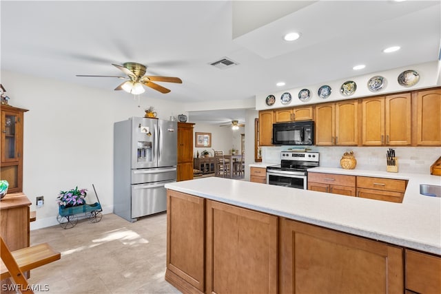 kitchen with light tile flooring, appliances with stainless steel finishes, tasteful backsplash, and ceiling fan