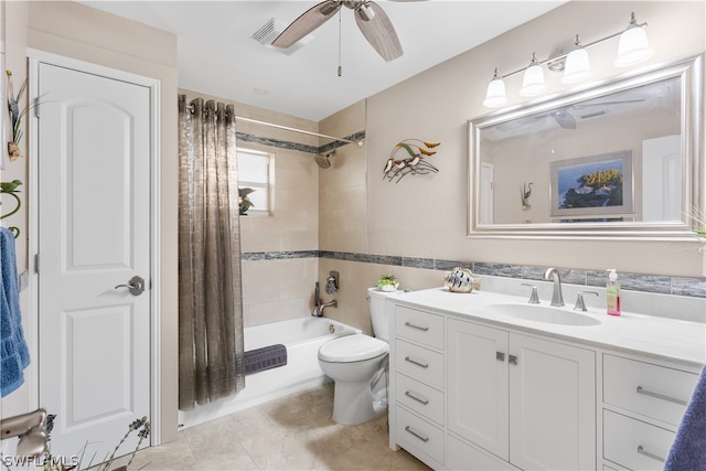 full bathroom with ceiling fan, shower / bath combo, toilet, vanity, and tile floors