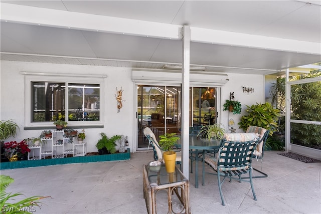 sunroom featuring beamed ceiling