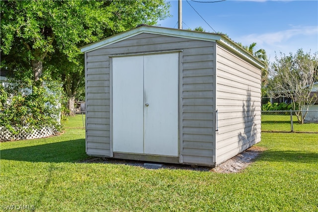 view of outdoor structure with a yard