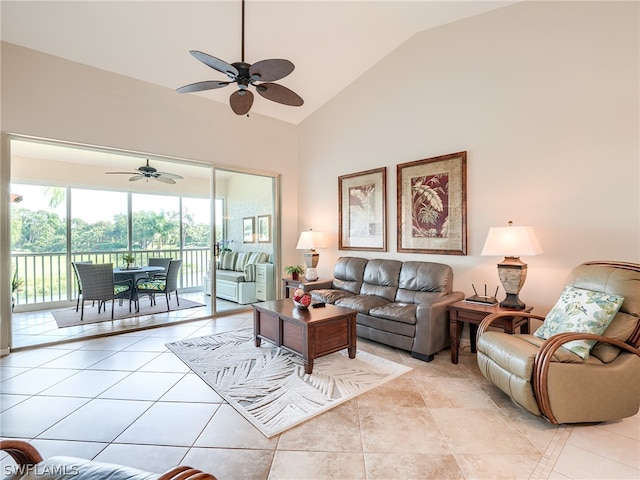 living room featuring high vaulted ceiling, ceiling fan, and light tile floors