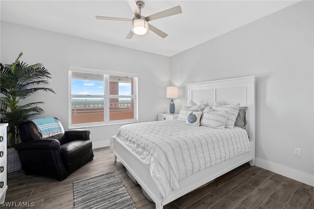 bedroom with ceiling fan and dark hardwood / wood-style flooring