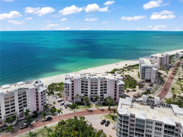 aerial view featuring a water view and a beach view