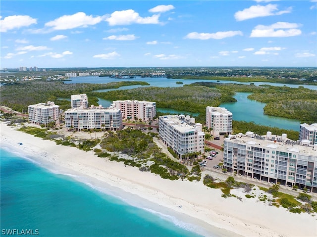 bird's eye view featuring a view of the beach and a water view