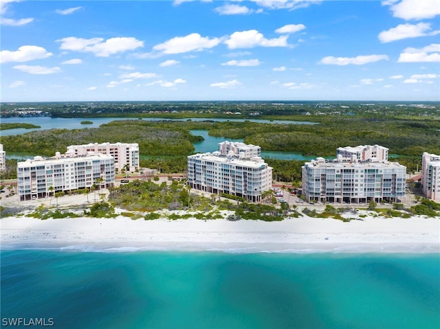 birds eye view of property featuring a view of the beach and a water view