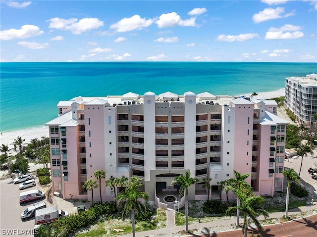 view of property with a water view and central AC