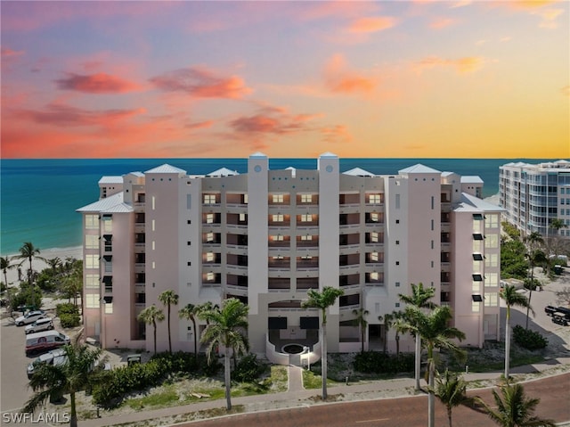 outdoor building at dusk featuring a water view