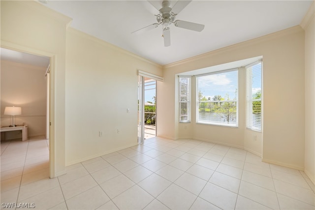 tiled spare room with ornamental molding and ceiling fan