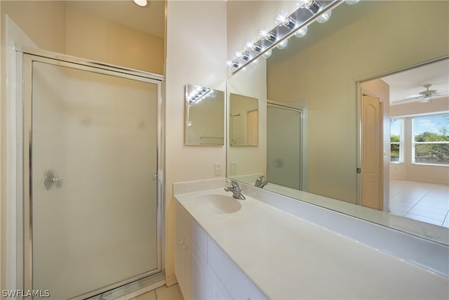 bathroom featuring an enclosed shower, ceiling fan, tile floors, and vanity