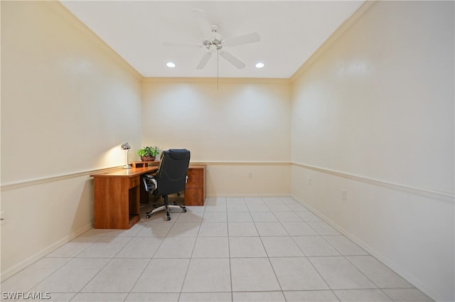 unfurnished office featuring ornamental molding, ceiling fan, and light tile floors