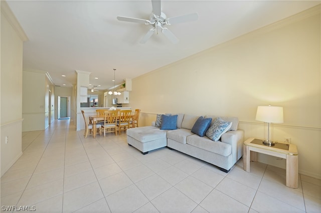 tiled living room with crown molding and ceiling fan