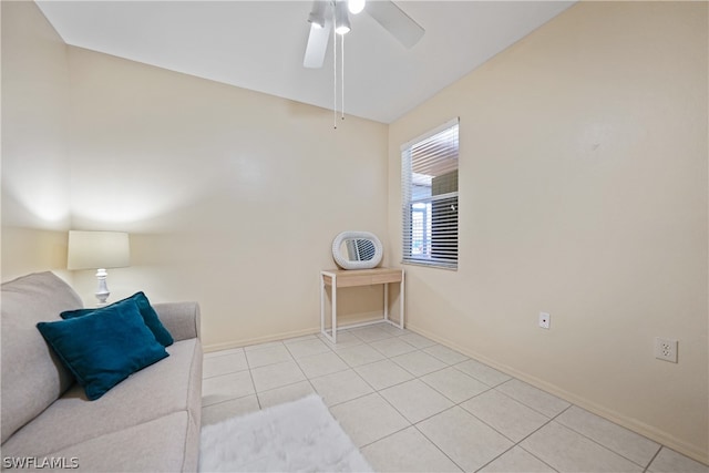 interior space featuring ceiling fan and light tile flooring