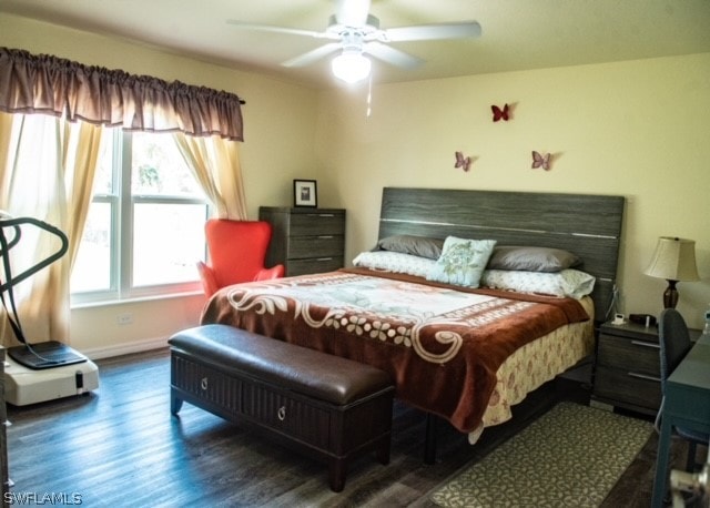 bedroom featuring ceiling fan and dark wood-type flooring