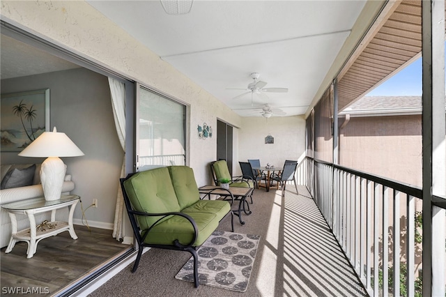 balcony featuring ceiling fan